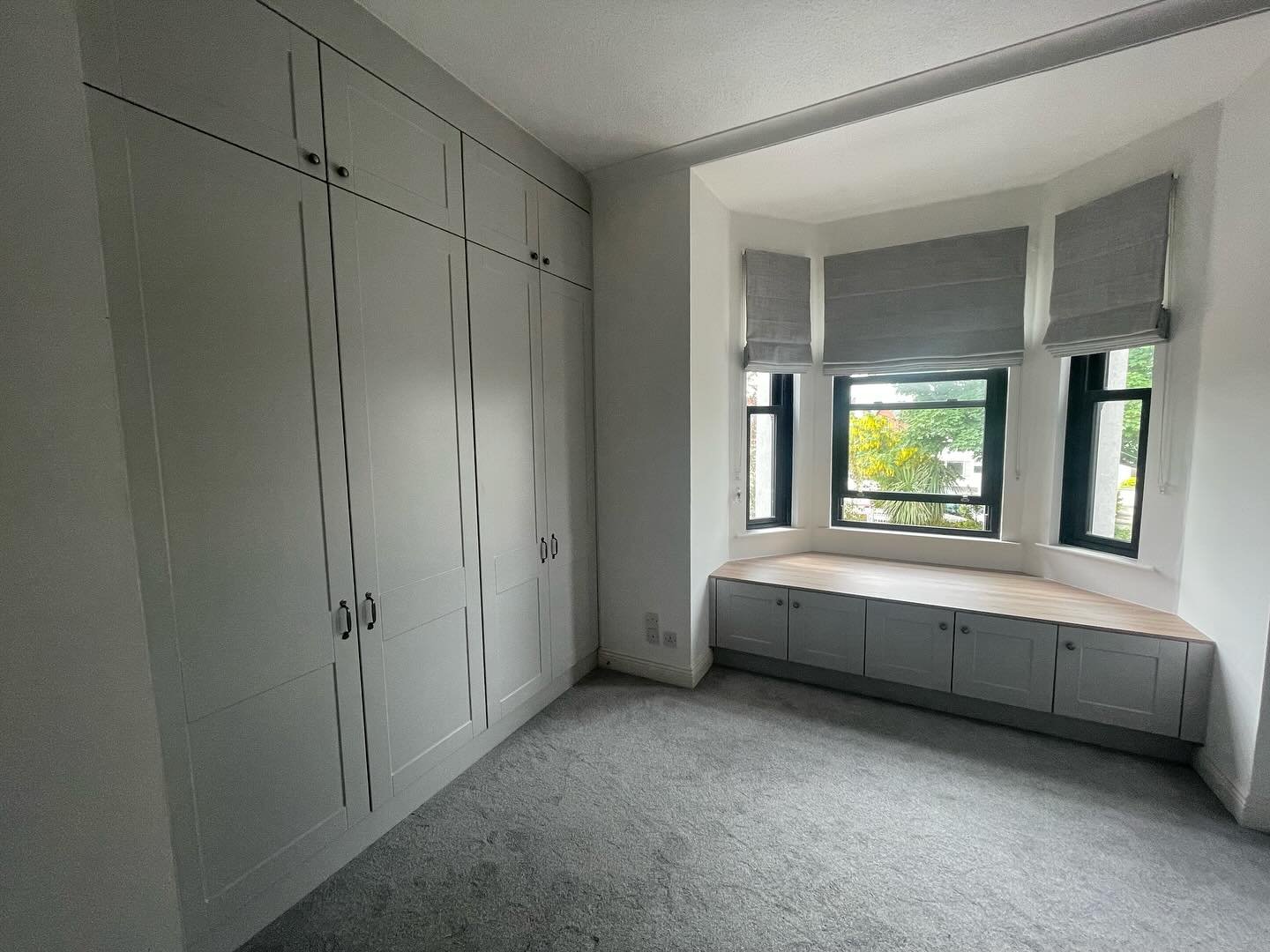 Light Grey Shaker Wardrobes with Oak Interior & Window Seat Storage image 1